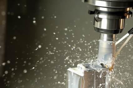 close-up of milling machine shaping a metal piece